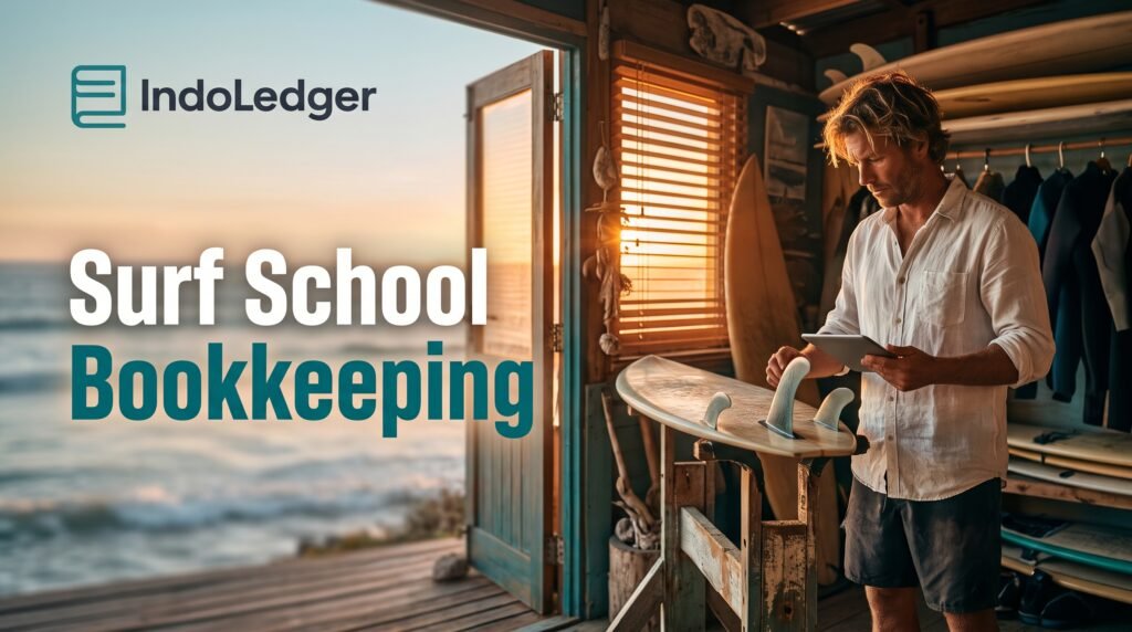 Surfboard and laptop on a desk showing surf school bookkeeping setup